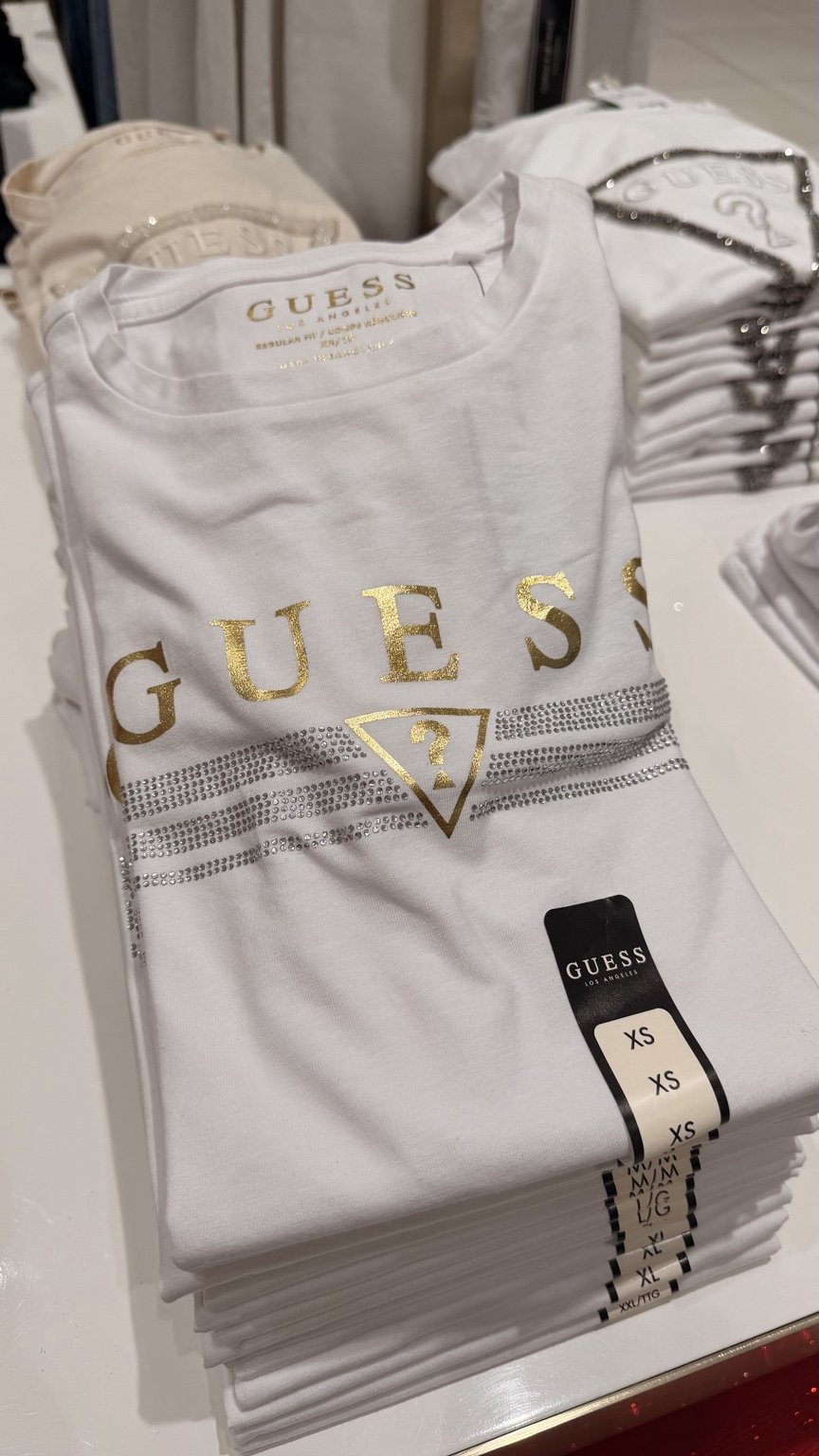 White gold triangle GUESS tee