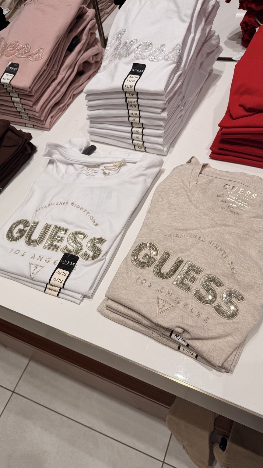 White and beige large GUESS tees