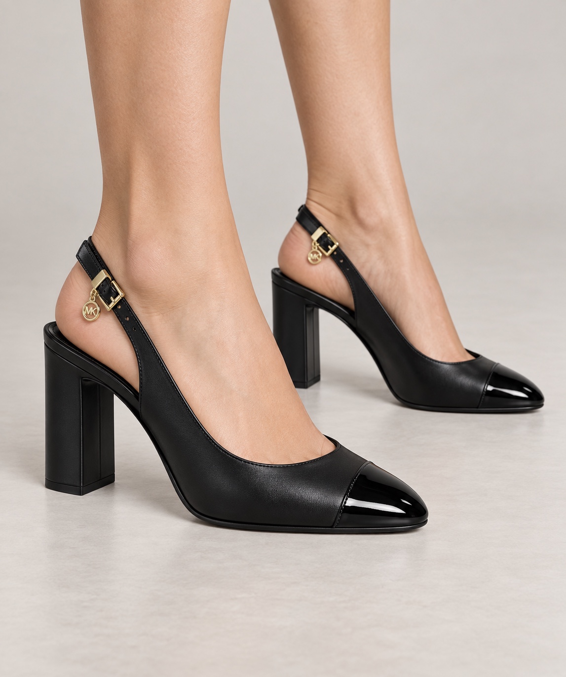 MK women’s black slingback block heels with patent cap toe