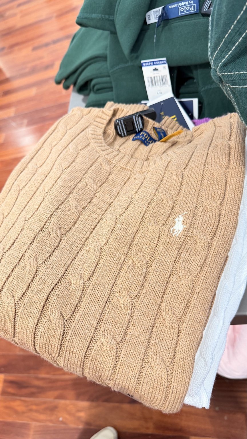 Camel cable-knit sweater · folded view