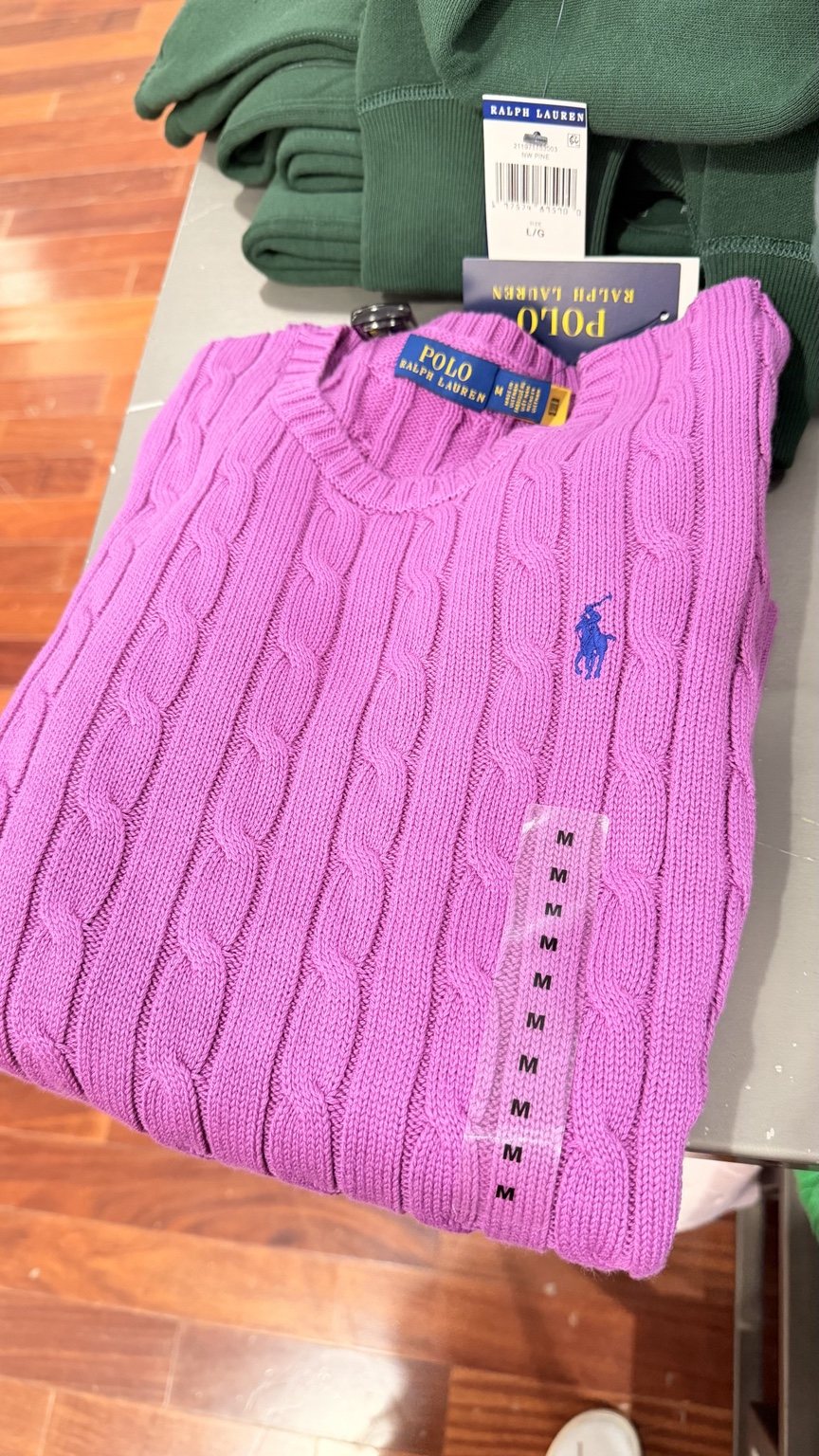Bright pink cable-knit sweater