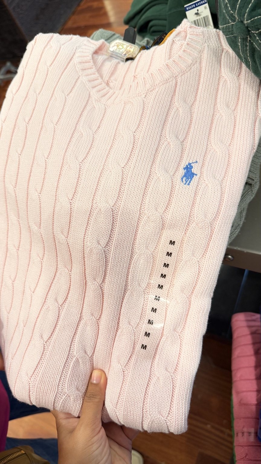 Pale pink cable-knit sweater