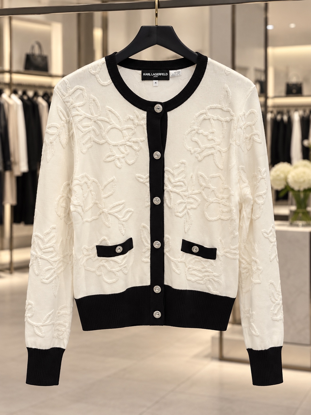 Ivory textured cardigan with black trim