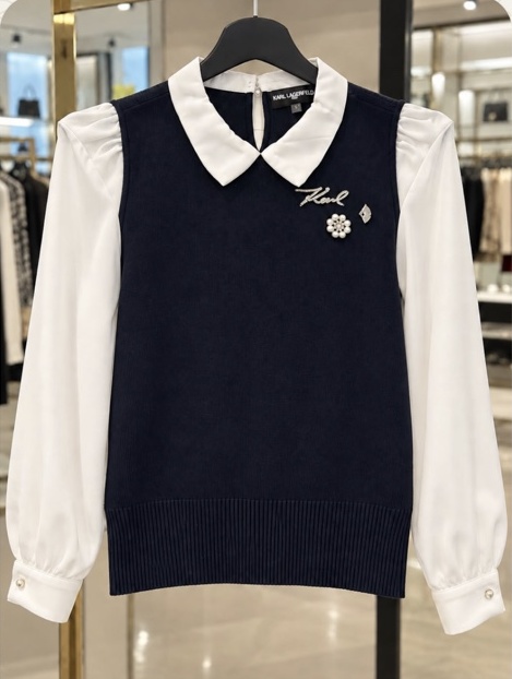 Navy layered knit top with white collar and sleeves