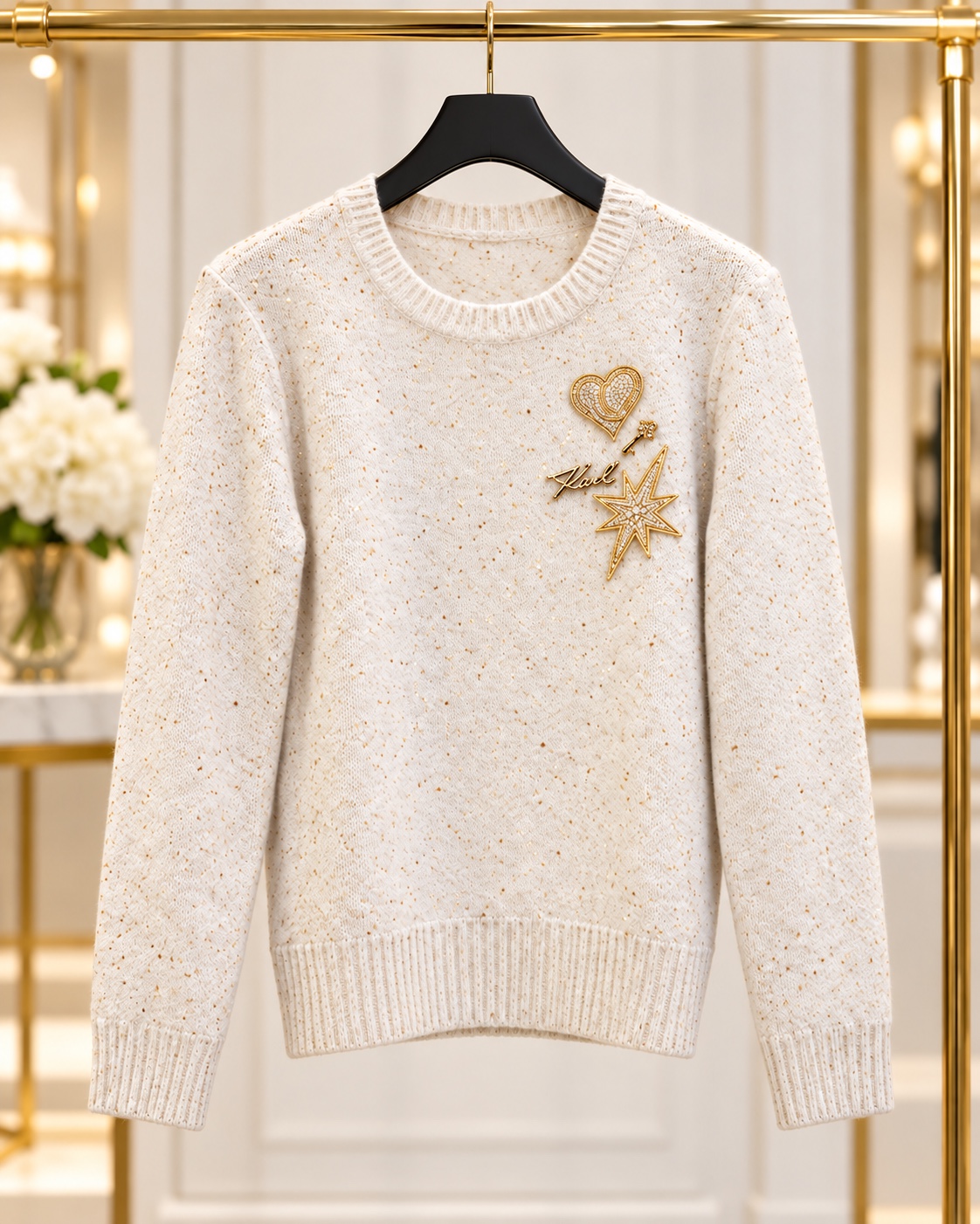 Ivory sweater with gold heart and star embellishments